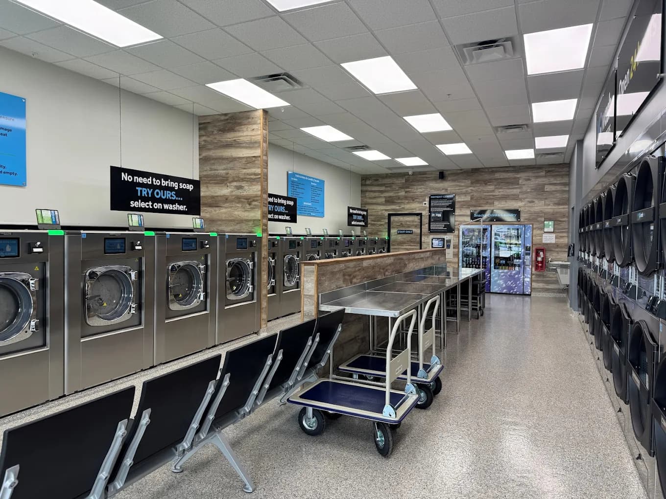 Inside YoWash Four Corners Express — 24-hour Girbau machines in a bright, modern interior
