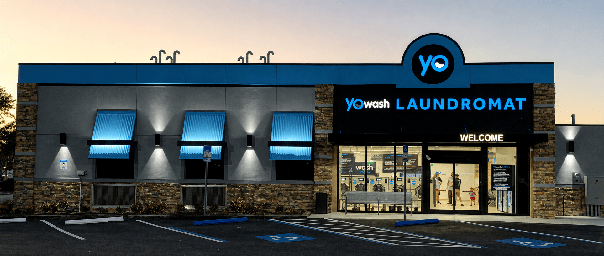 YoWash storefront at twilight